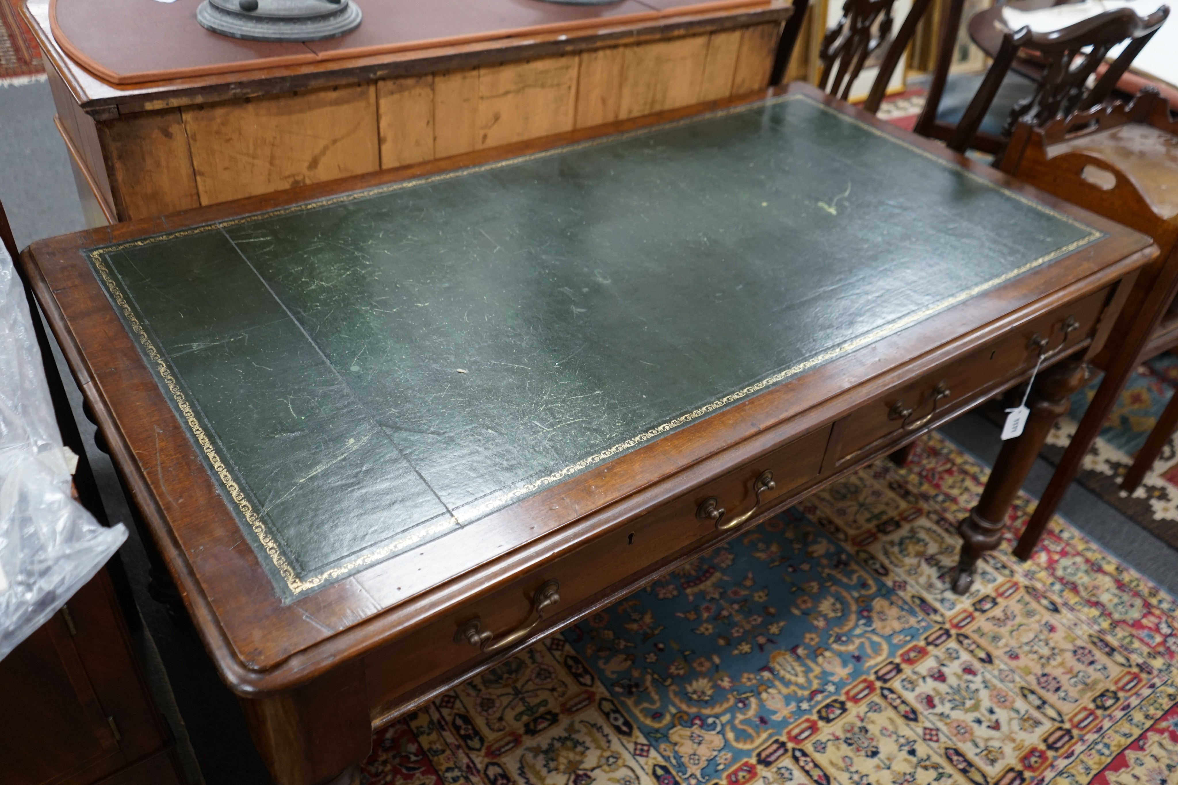 A Victorian mahogany two drawer library table, width 136cm, depth 74cm, height 74cm